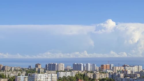 Sunny Summer Town and Daytime Clouds
