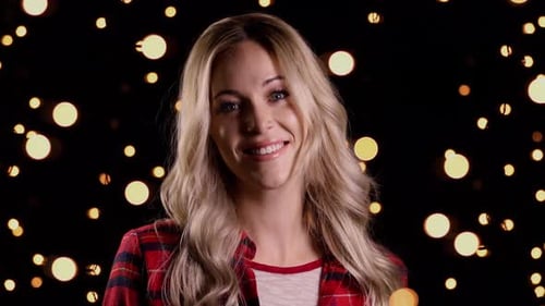 Smiling Woman With Blonde Hair With Christmas Lights