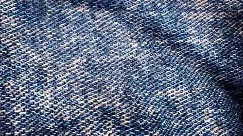 Dynamic Light and Shadow on Blue Denim Fabric Texture