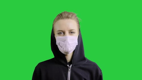 Woman Wearing Face Mask Because of Air Pollution or Virus Epidemic in the Chromakey Background