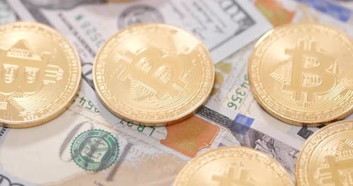 Gold Bitcoins over United States Currency