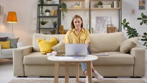 Woman Working On Laptop At Home