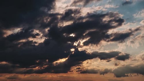 Dramatic Clouds Moving at Sunset