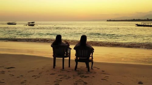 Beautiful beauty models on holiday spending quality time at the beach on paradise white sand and blu