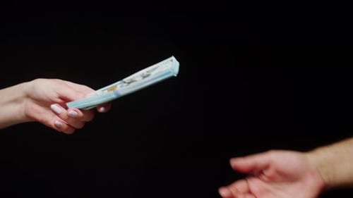 Money Exchanged Between a Woman and a Man