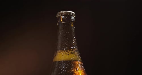 Close-Up of a Chilled Beer Bottle with Condensation
