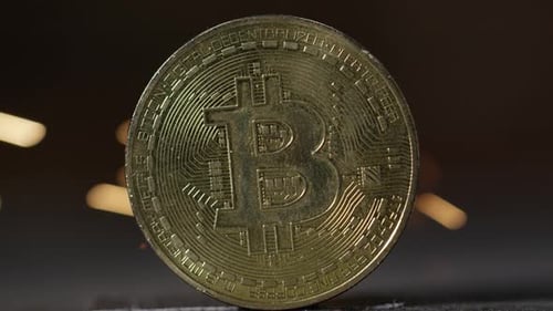 Cryptocurrency on the block chain - close up of bitcoin altcoin physical coins in dynamic setting