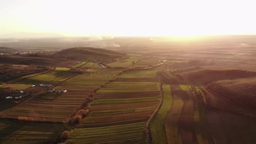 Flying Over the Amazing Rolling Hills of Tuscany Italy at Sunset