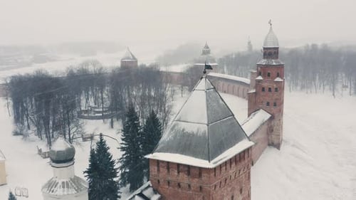 Snowy Aerial View of a Medieval Fortress in Winter
