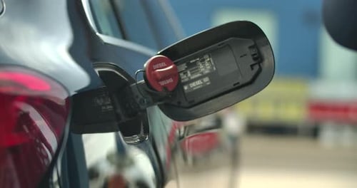 Refiiling the Car with Fuel at the Fuel station