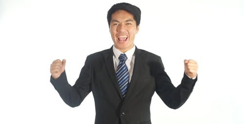 Successful Man Celebrating Achievement in Business Suit