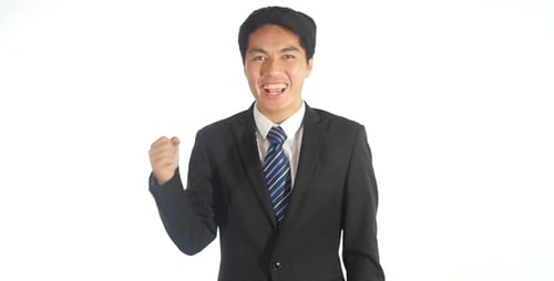 Enthusiastic Young Adult Man Pumping Fist