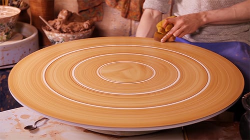 Potter Designs Abstract Circles on Rotating Clay Plate