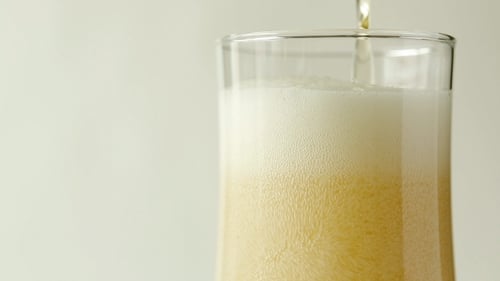 Pint of Delicious Beer being Poured Close Up