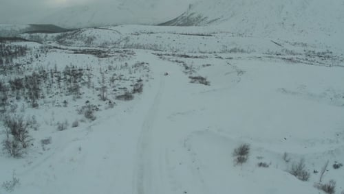 Alone Car On The Snowy Road