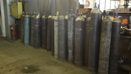 Industrial Gas Tanks in Storage at Workshop