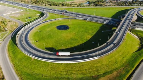 Cars Drive Along Highway with Comfortable Round Junction