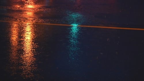 Abstract Light Reflections on Wet Street at Night