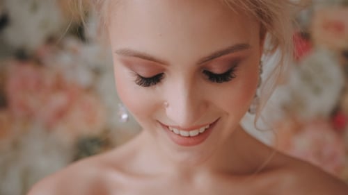 Beautiful Woman Smiling with Elegant Makeup