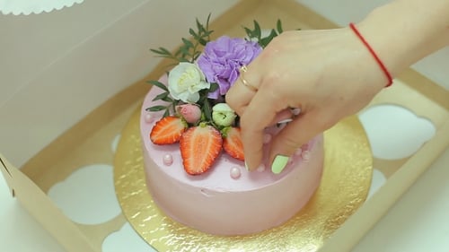 Decorating a Beautiful Birthday Cake with Flowers