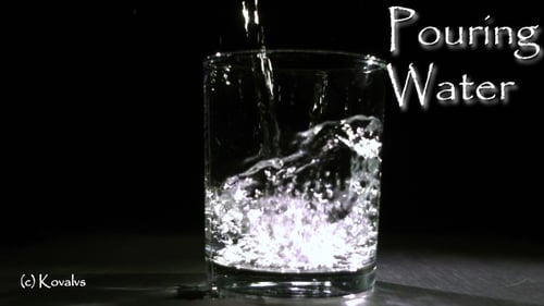 Pouring Water In The Glass