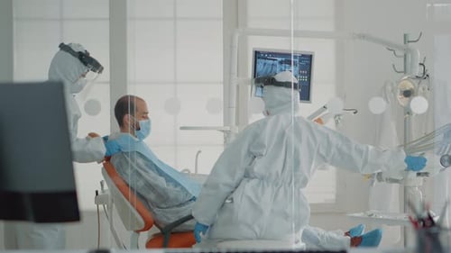 Patient Awaits Dental Exam in Protective Gear