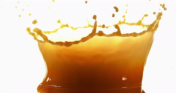 Orange Juice exploding against White Background, Slow Motion 4K, Nature ...