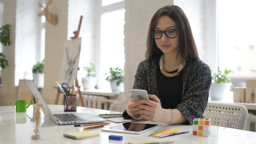 Smiling Female Designer Texting Message, Working in Office