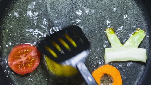 Vegetables Arranged to Spell Cook in Boiling Water