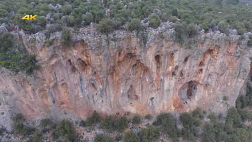 Aerial Climber on Rocky Cliff