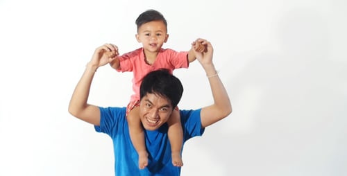 Father Carries Adorable Infant Son On His Shoulders