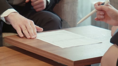 Business Male And Female Sign Paper