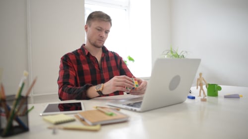 Creative Designer Solving Rubik Cube