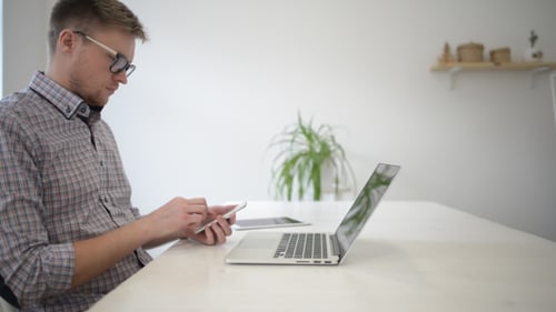 Freelancer Working In Studio with Smartphone