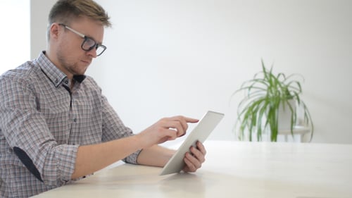 Serious Designer Working on Tablet