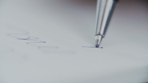 Silver Pen Writing Smoothly on Paper