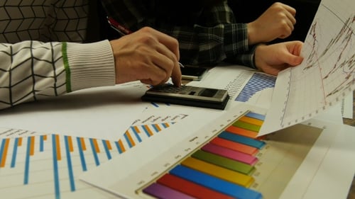 Business Team Reviewing Graphs and Charts