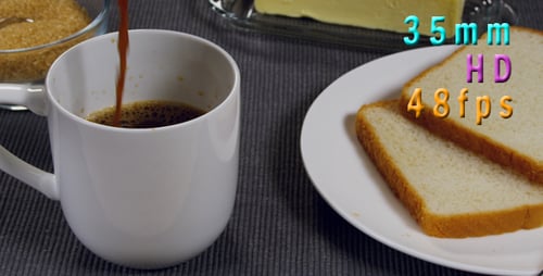 Coffee Being Poured Next to Toast and Butter