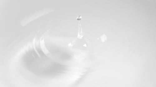Abstract Water Droplets Impacting Clean White Surface