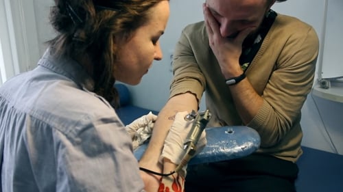 Tattoo Artist at Work, Customer in Pain