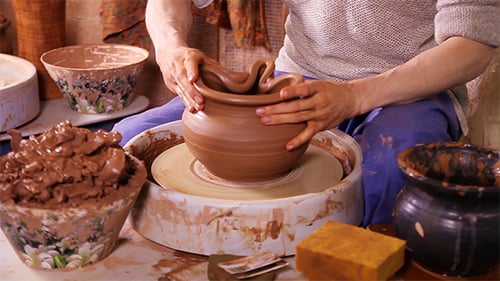 Potter Sculpting a Traditional Clay Pot