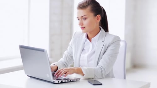 Woman With Laptop Talking On Smartphone At Office 61