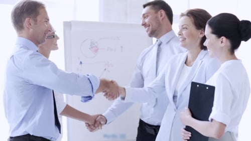 Happy Business Partners Making Handshake At Office 83