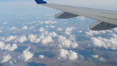 Airplane View of Clouds and Landscape
