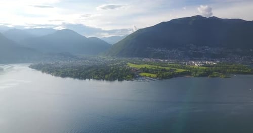 Aerial drone view of boat boating on Lake Maggiore, Switzerland.