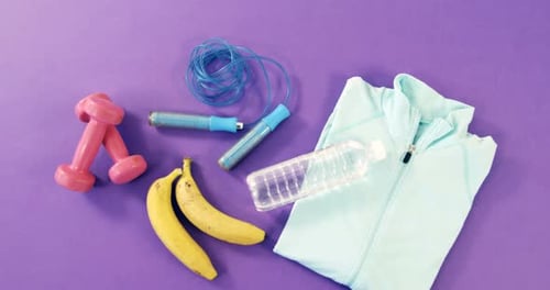 Colorful Fitness Equipment on Purple Background