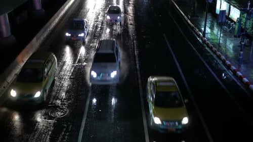 Night Traffic on Wet City Street