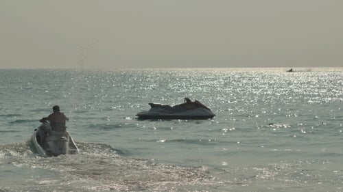 Jet Skis Gliding Across the Sparkling Ocean Waters