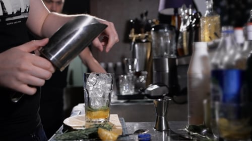 Bartender Preparing a Cocktail with Ice