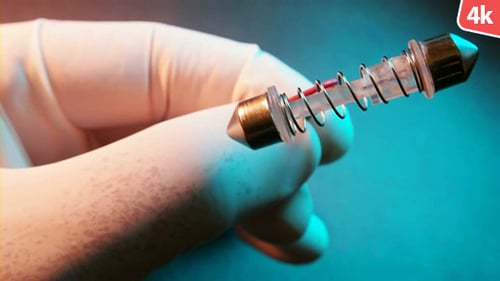 Gloved Hand Holding Laboratory Equipment Close Up